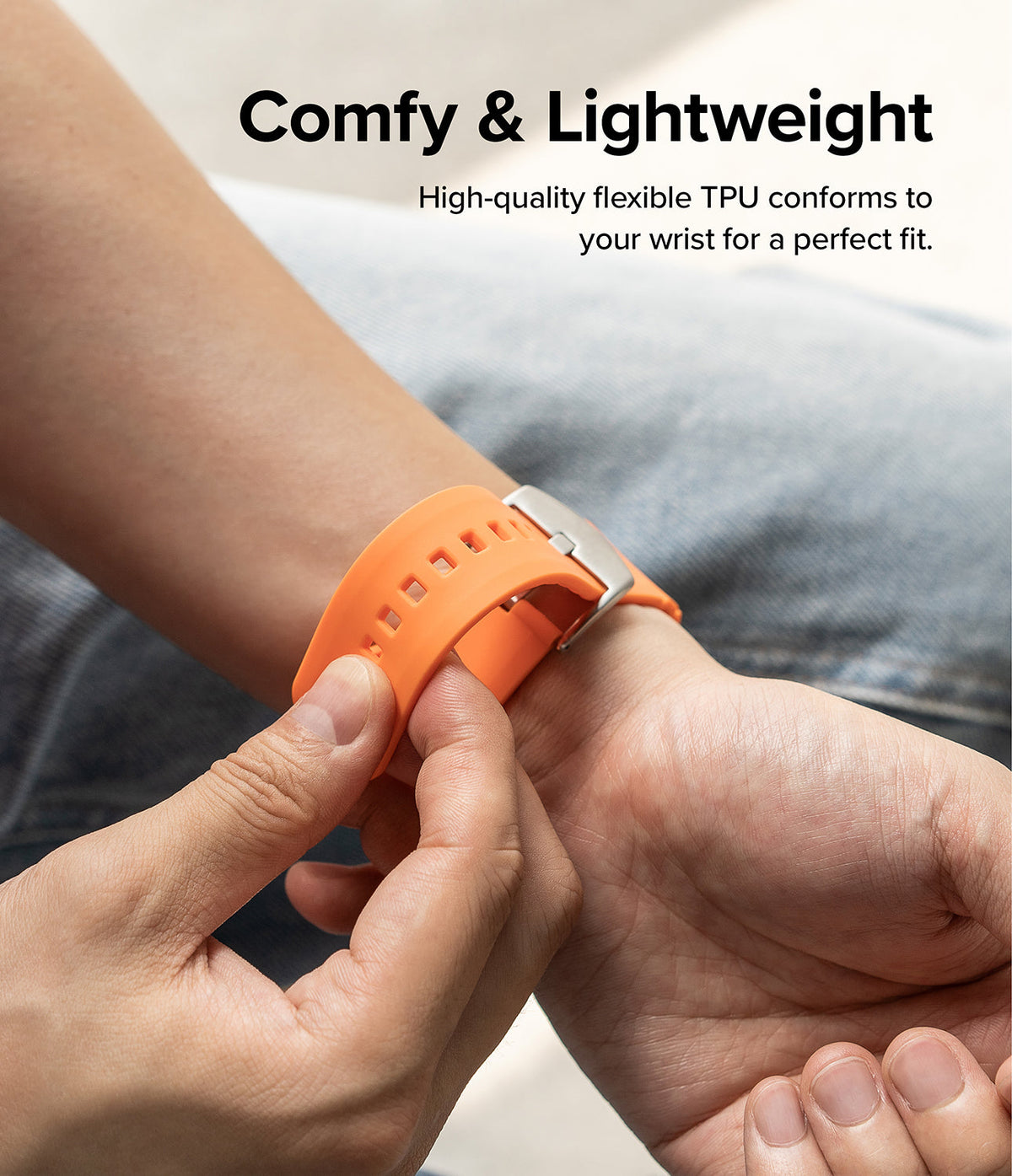 Apple Watch 49·46·45·44·42mm | Rubber One Bold Band - Person wearing a flexible orange TPU watch band on their wrist.