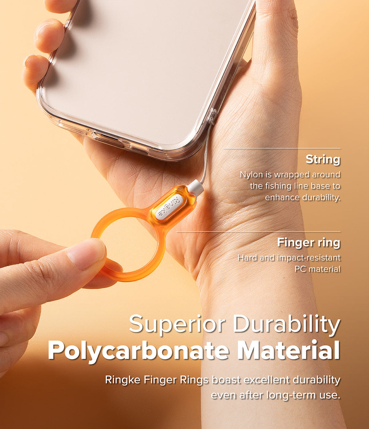 Buckle Finger Ring Strap - Hand holding a phone with an orange polycarbonate finger ring strap attached via a nylon cord.