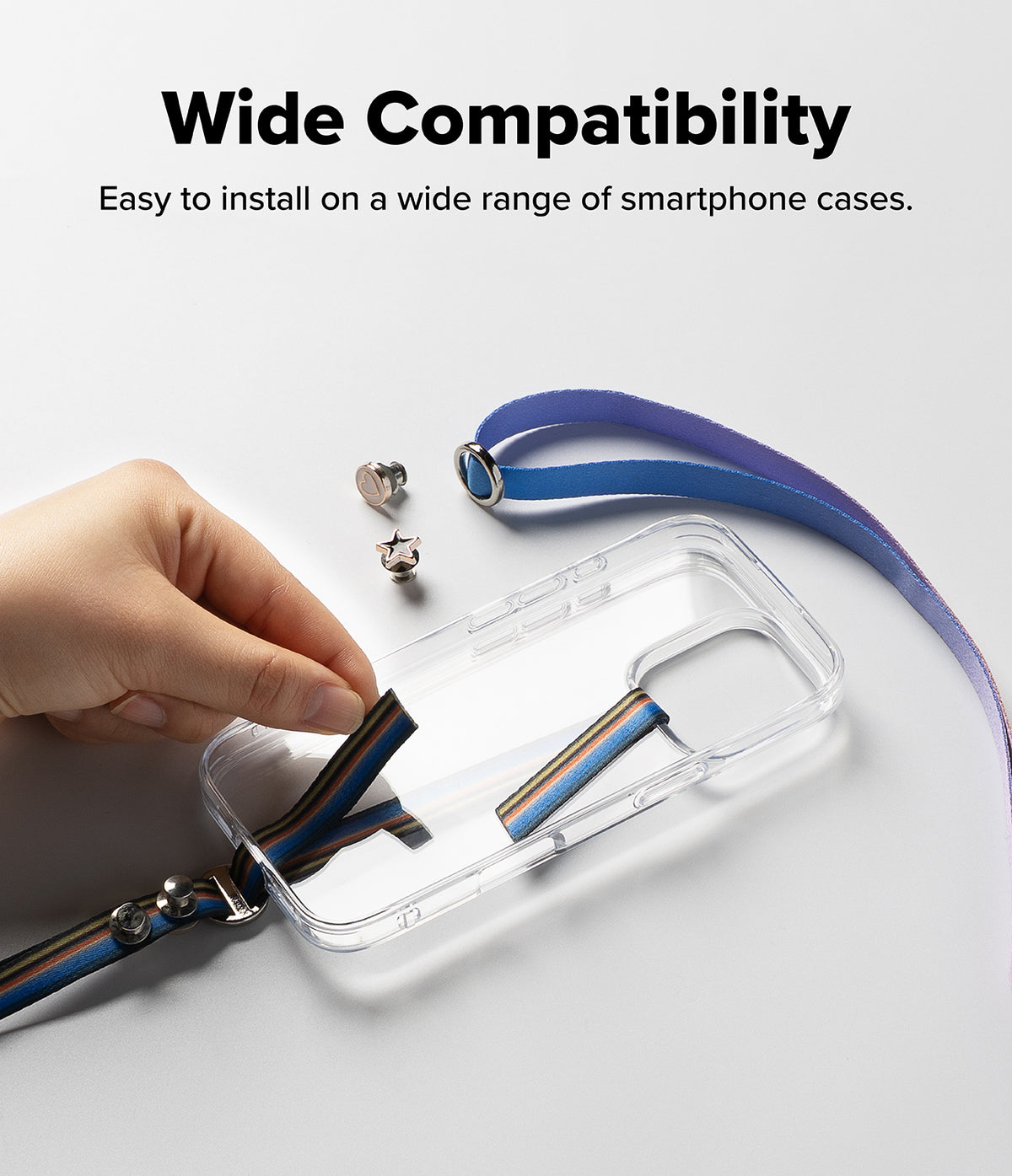 Band Buckle Circle Type Strap - Hand attaching a colorful fabric strap to a clear phone case with metal hardware.