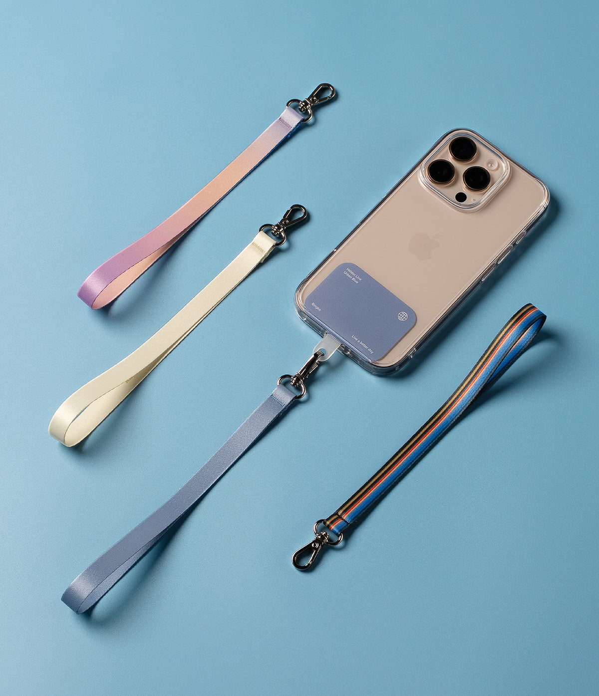 Hand Strap Hook - A smartphone with a card holder attached, surrounded by four colorful fabric wrist straps on a blue background.