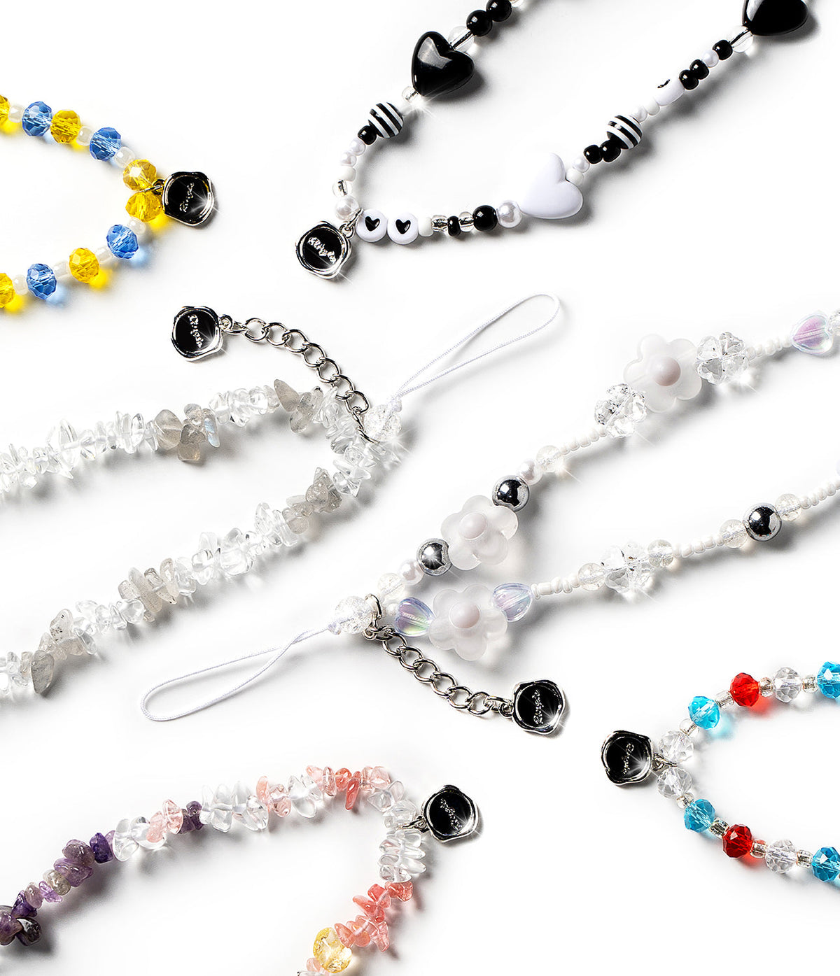 Beaded Strap - Assorted colorful beaded phone straps with crystal chips, heart charms, and flower accents on white background.