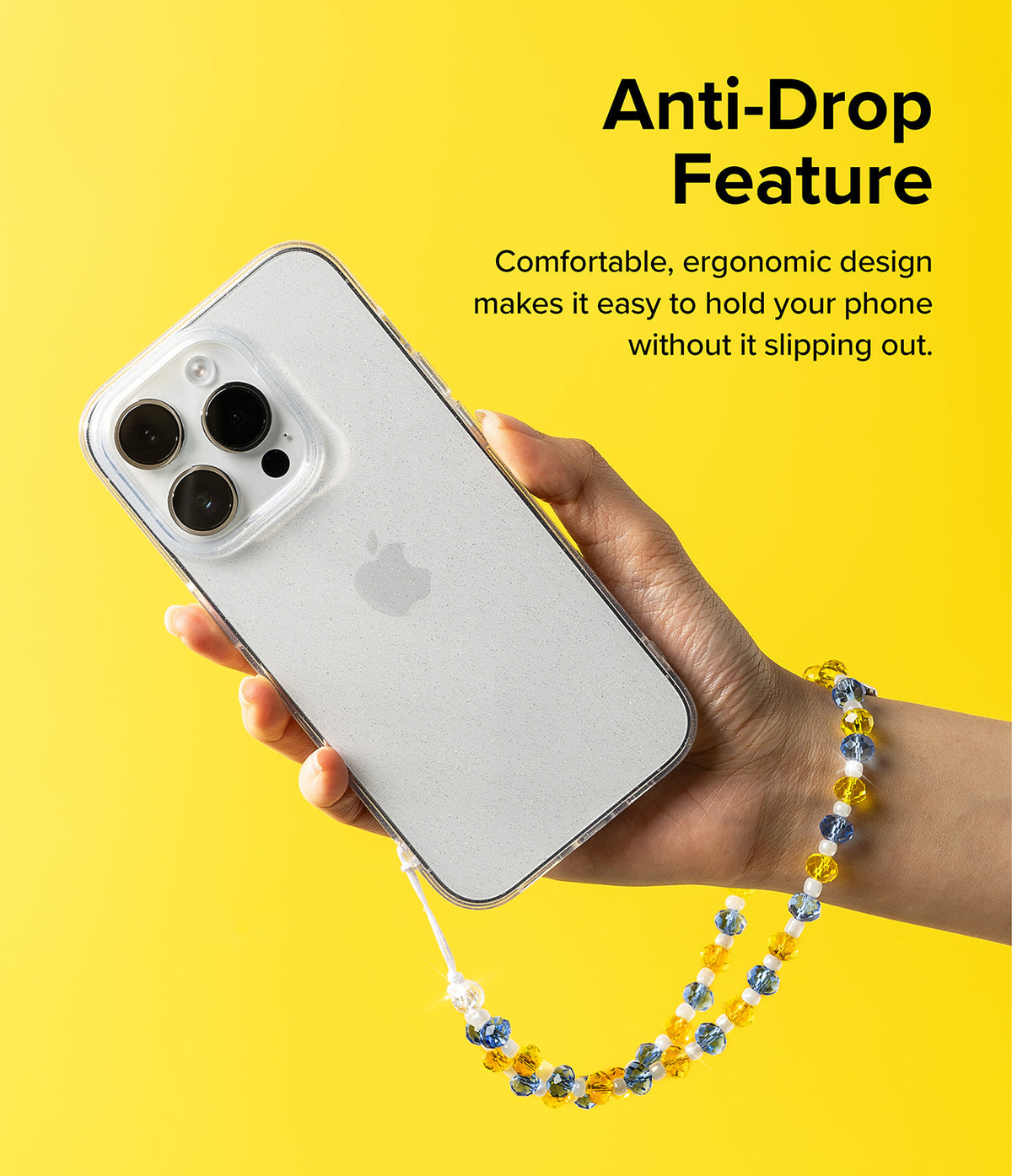 Beaded Strap - Hand holding a phone with a yellow and blue beaded wrist strap against a bright yellow background.