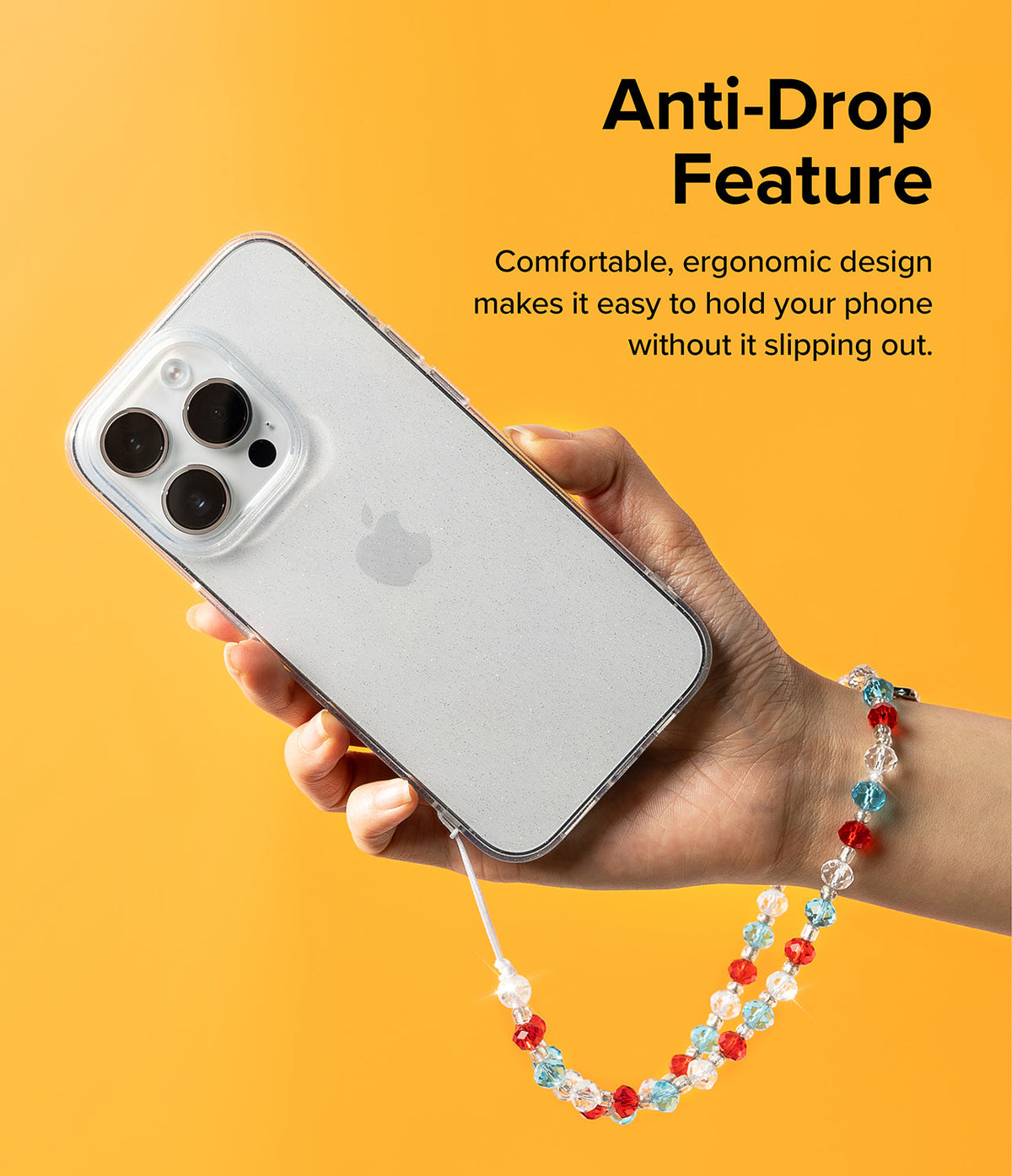 Beaded Strap - Hand holding a phone with a colorful red, blue, and clear beaded wrist strap against a yellow background.
