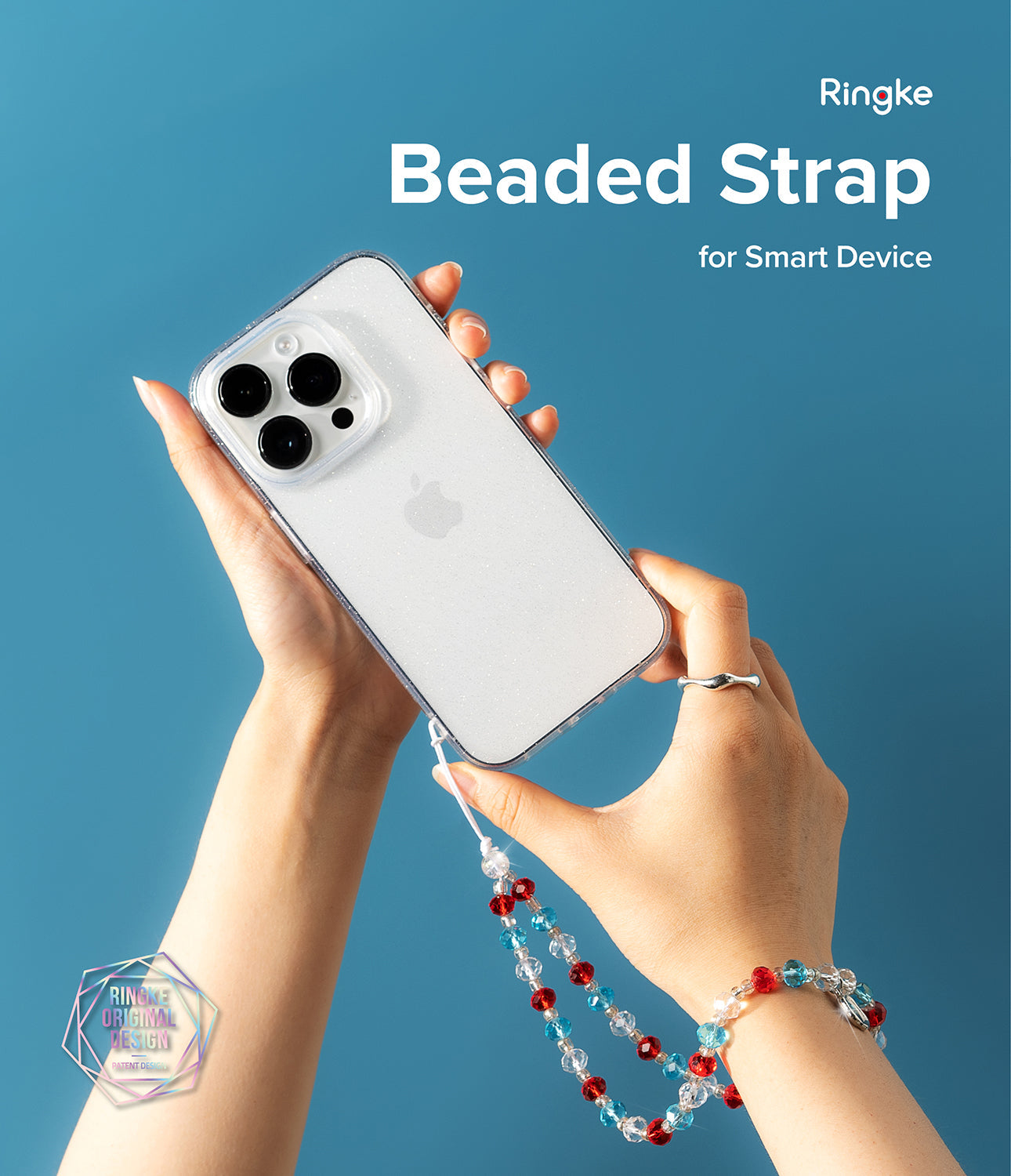 Beaded Strap - Hands holding a glittery phone case attached to a colorful red, blue, and clear beaded wrist strap.