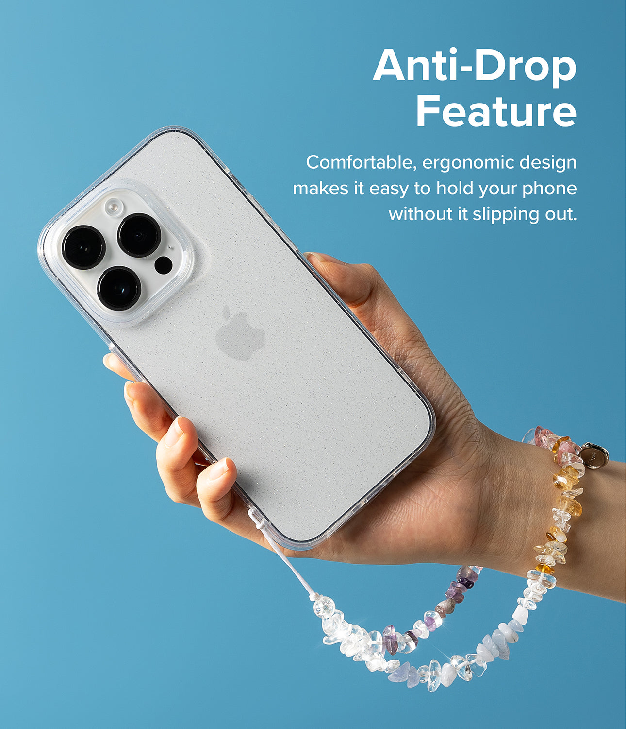 Beaded Strap - Hand holding a phone with a clear case and a decorative beaded wrist strap against a blue background.