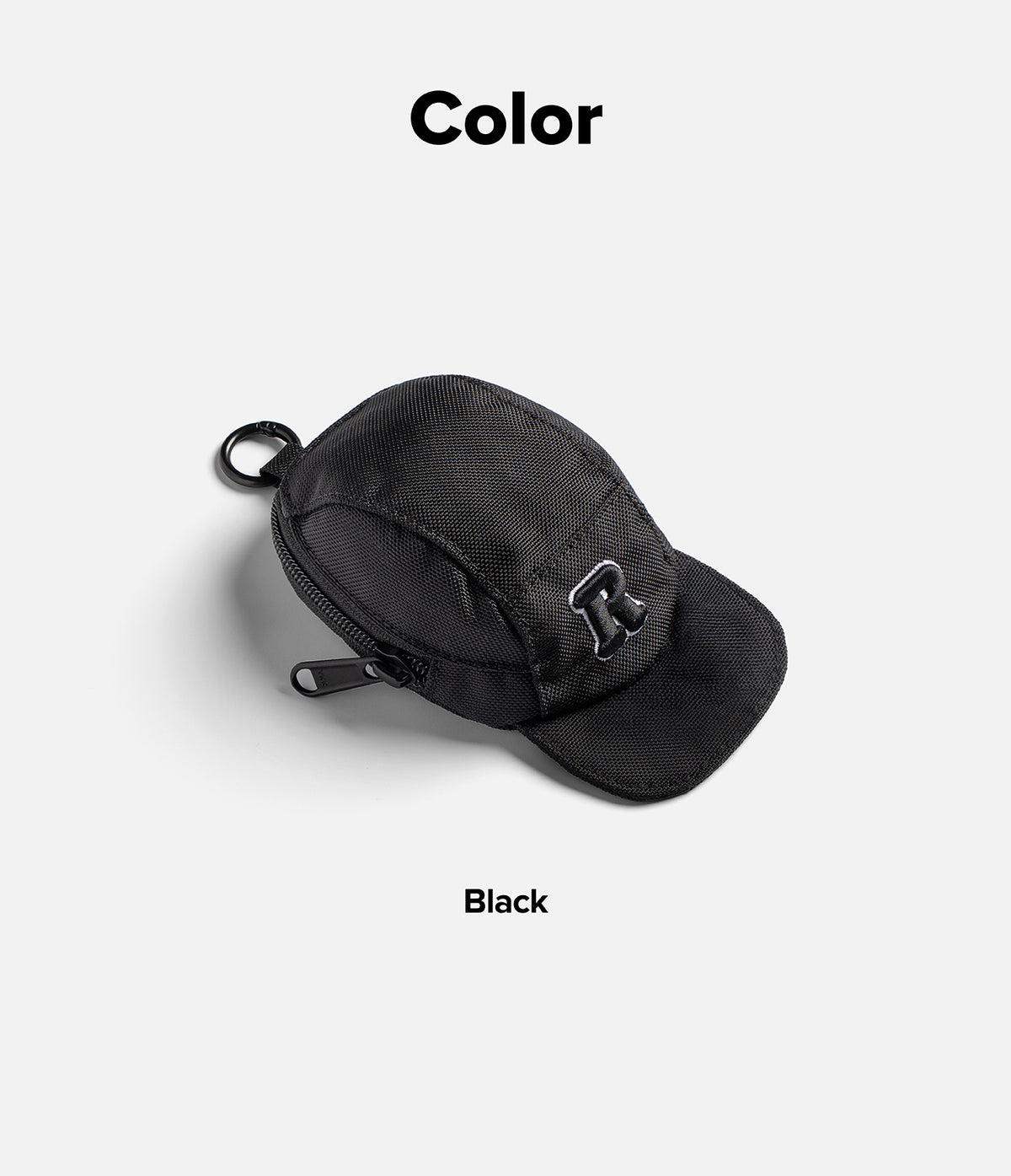 Mini Pouch | Cap - Black cap-shaped mini pouch with a zipper, key ring, and an R logo patch on a light gray background.