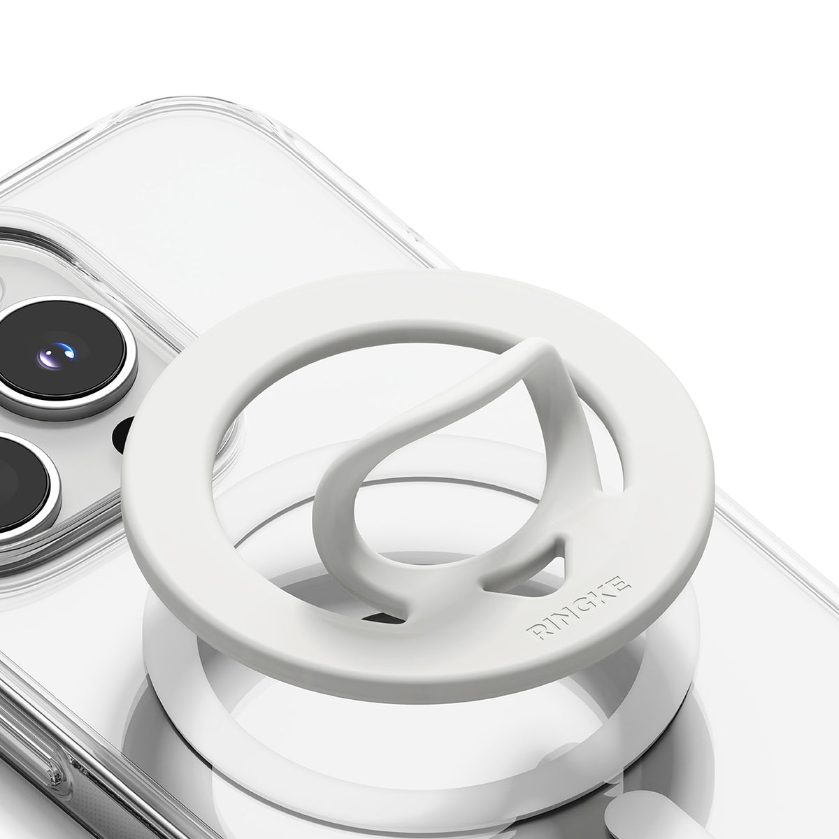 Dual Magnetic Silicone Ring - White silicone magnetic phone ring holder with a pull-out loop attached to a clear phone case.