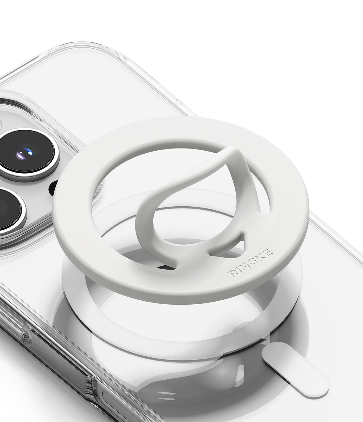 Dual Magnetic Silicone Ring - White silicone magnetic phone ring holder with a pull-out loop attached to a clear phone case.