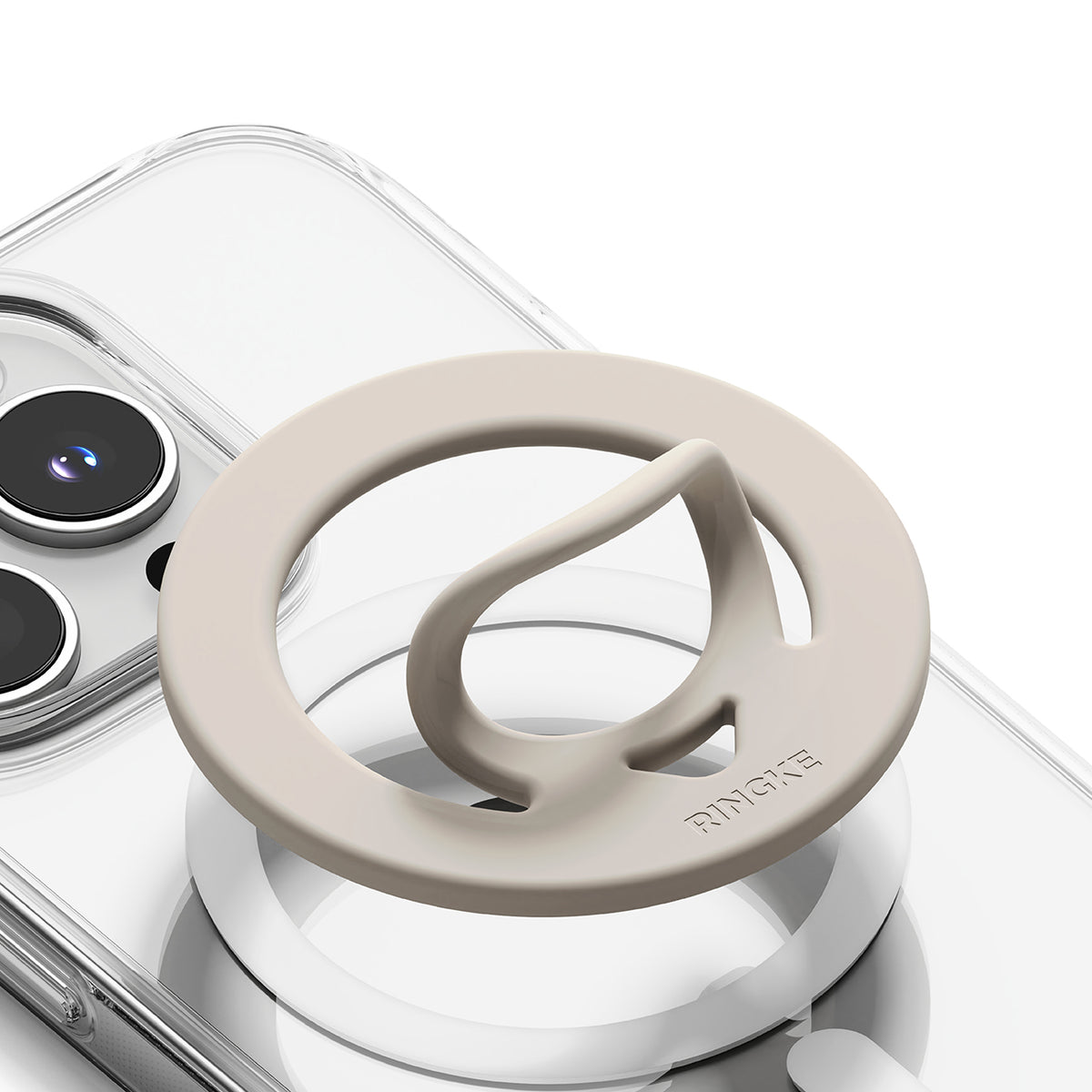 Dual Magnetic Silicone Ring - Beige silicone ring with a pop-out finger loop attached to a clear phone case.