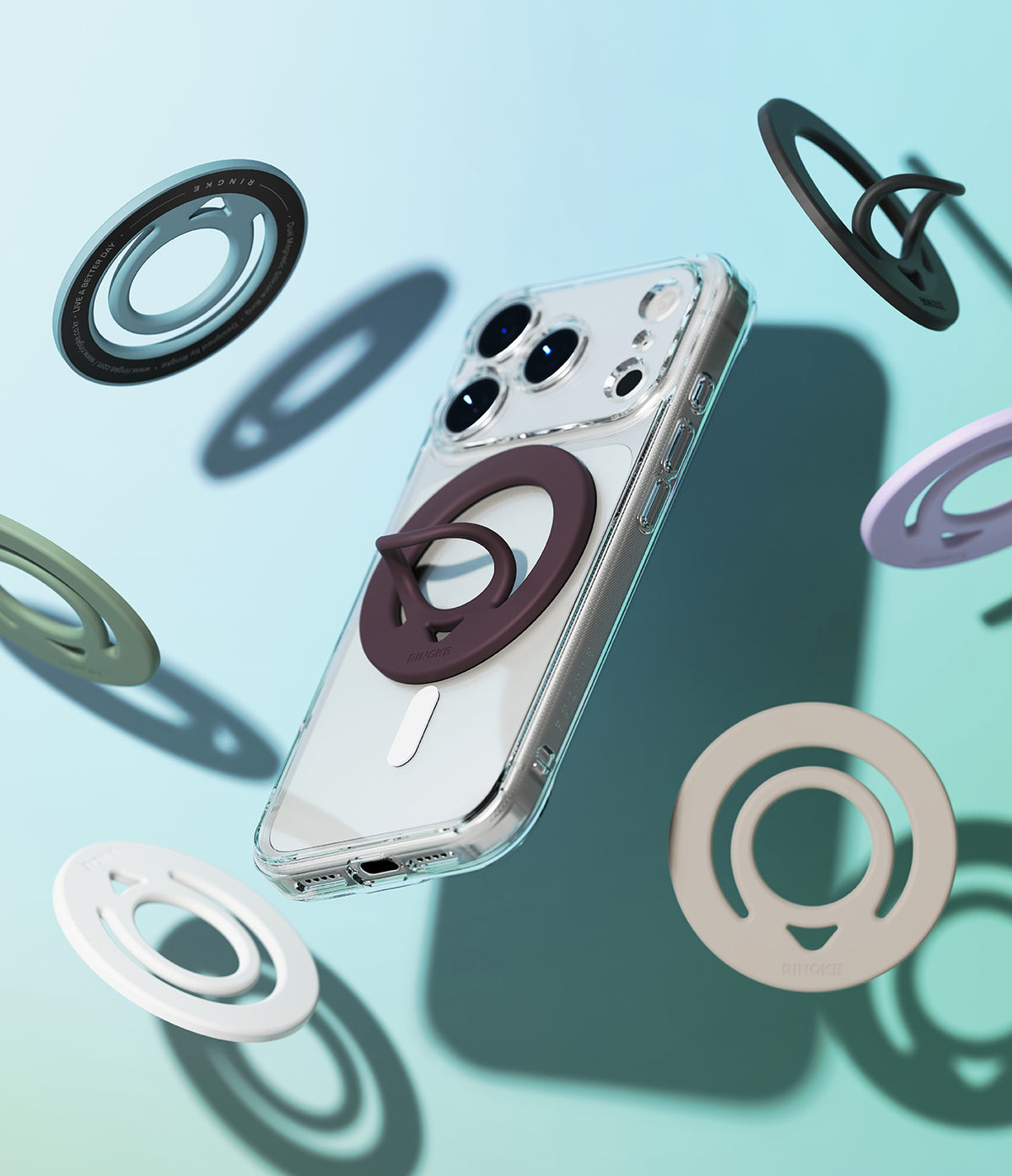 Dual Magnetic Silicone Ring - A smartphone with a blue magnetic ring attached, surrounded by floating rings in various colors.