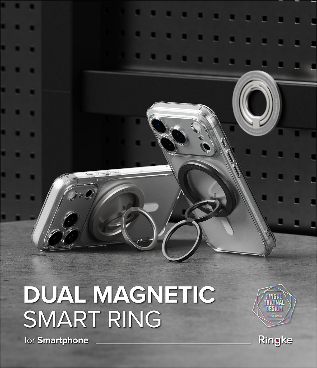 Dual Magnetic Smart Ring - Two smartphones with silver and black magnetic ring holders attached, set against a pegboard.