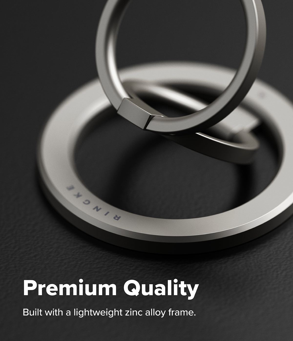 Dual Magnetic Smart Ring - Silver dual-ring phone holder with a zinc alloy frame on a dark textured surface.