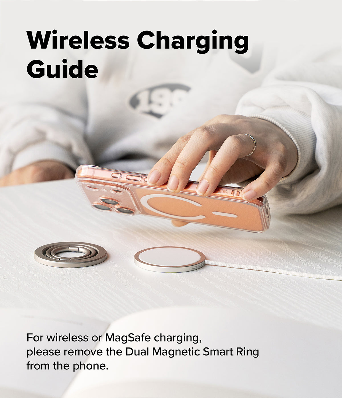 Dual Magnetic Smart Ring - A hand holding a phone above a wireless charger, showing the ring must be removed for charging.