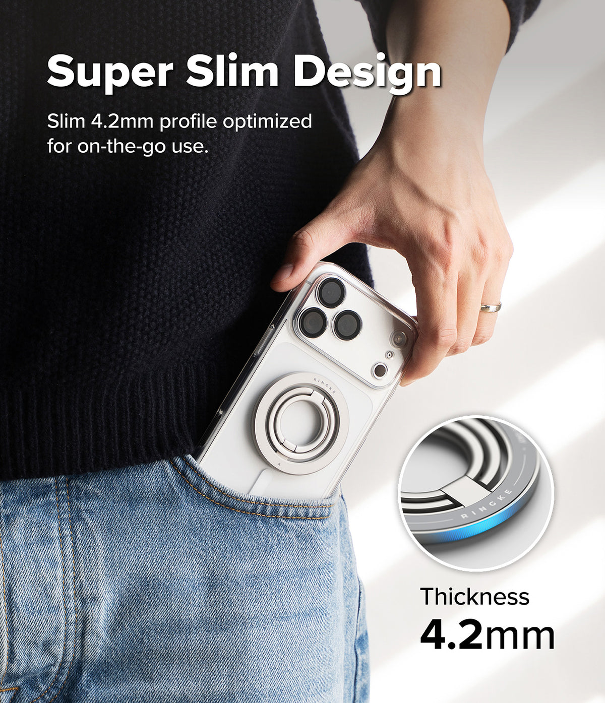 Dual Magnetic Smart Ring - A hand slides a phone with a slim silver magnetic ring into a jeans pocket, highlighting 4.2mm thickness.