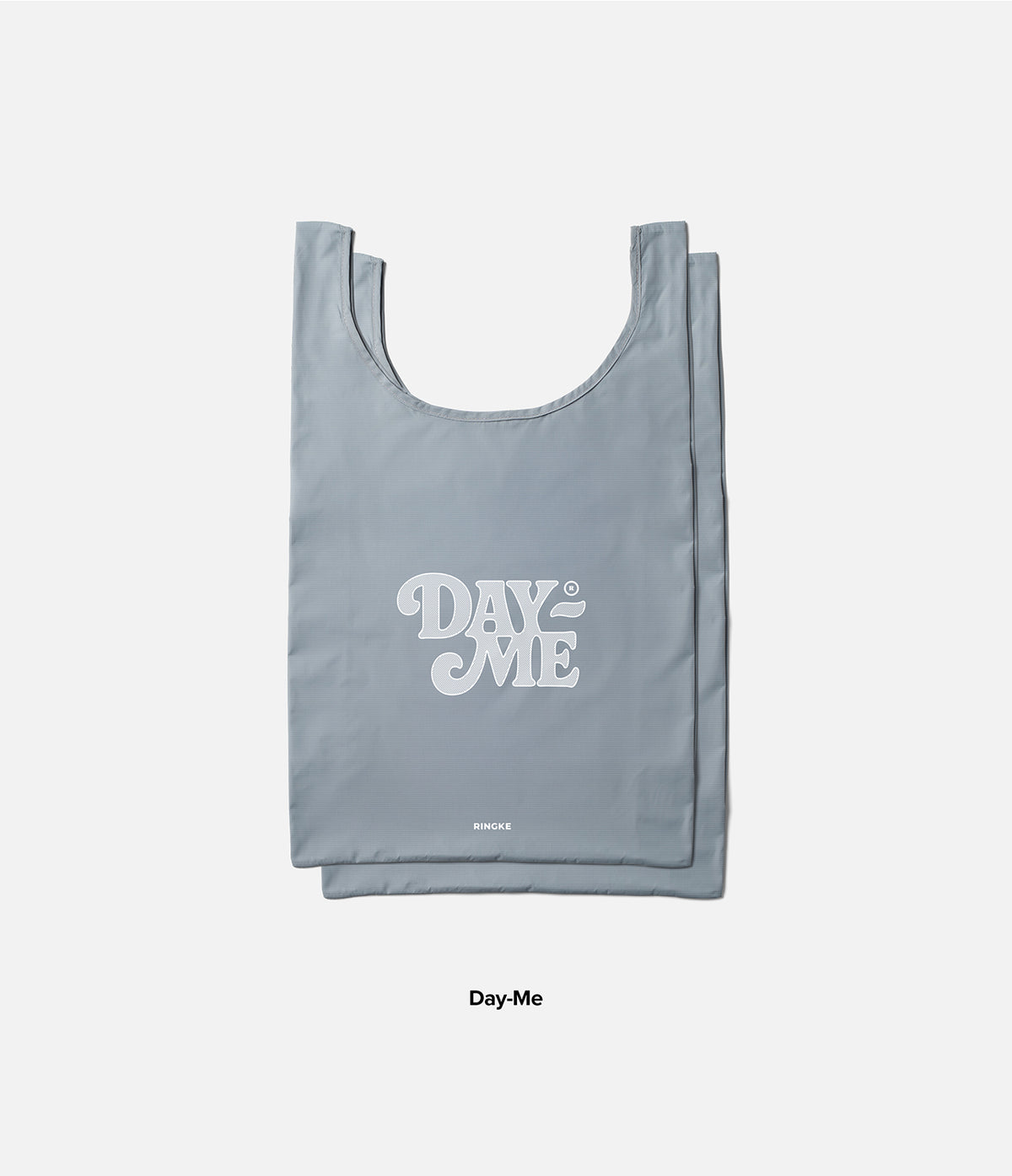Day-Me Bag - A grey reusable tote bag with white Day-Me logo and small Ringke branding on a light background.