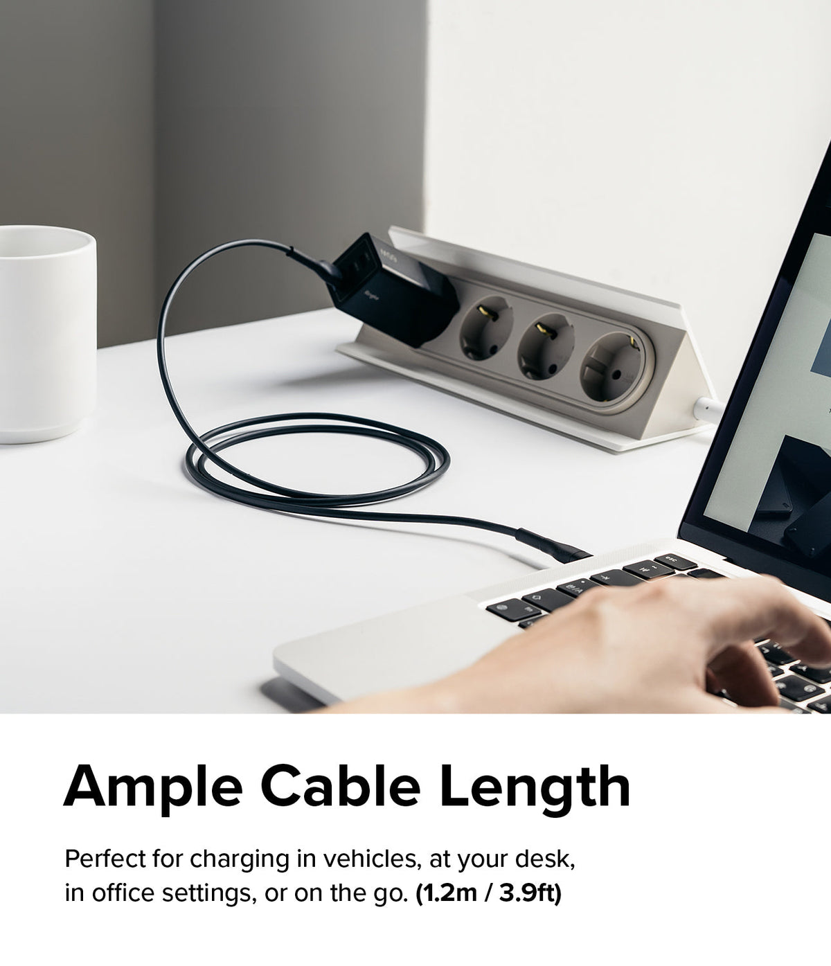 Ringke Fast Charging Pastel Cable - A Type-C Type - Black charging cable connecting a laptop to a desk power strip.