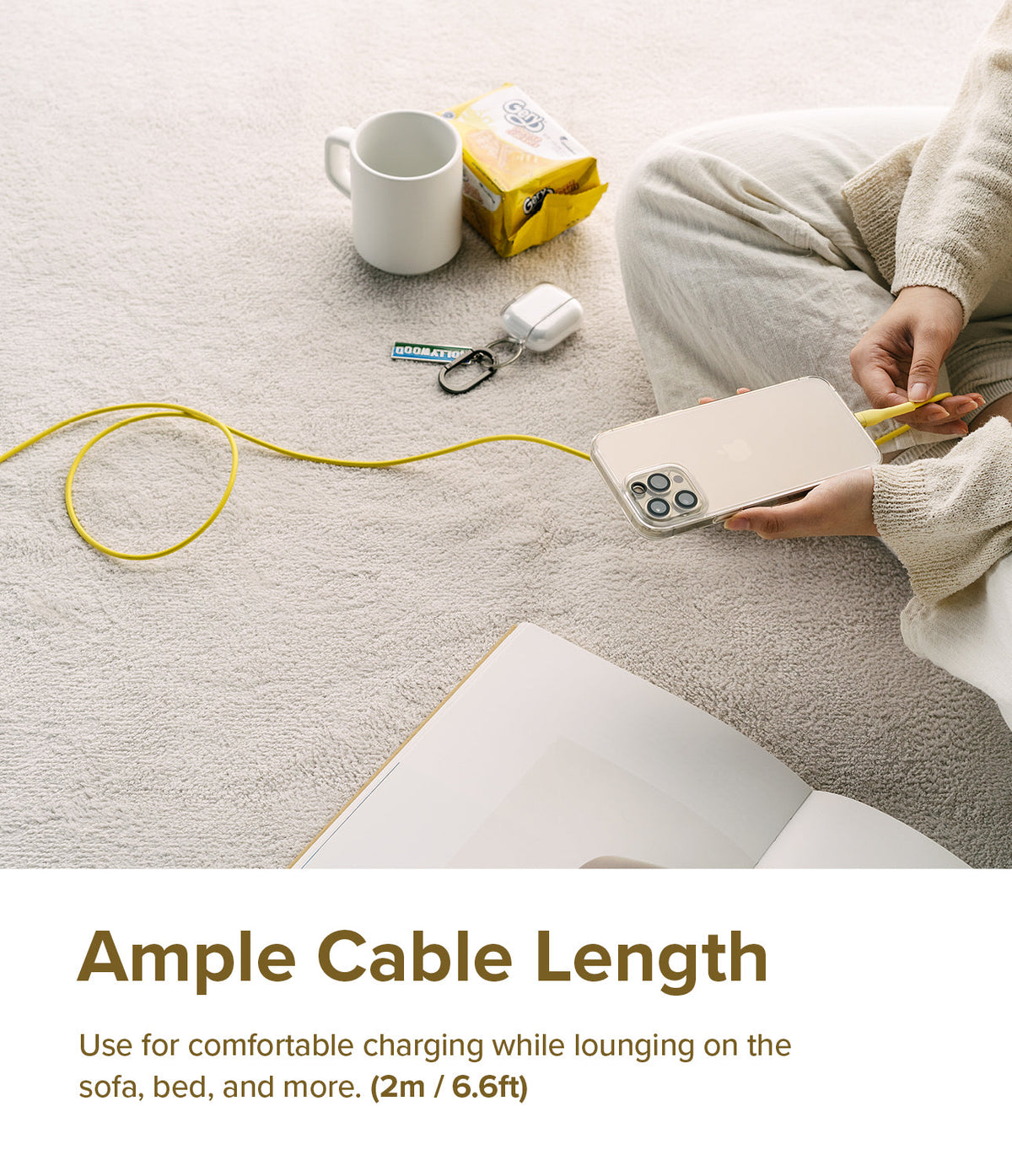 Ringke Fast Charging Pastel Cable - C Type-C Type - Ringke Fast Charging Pastel Cable - Person sitting on a rug charging a smartphone with a long, bright yellow USB-C cable.