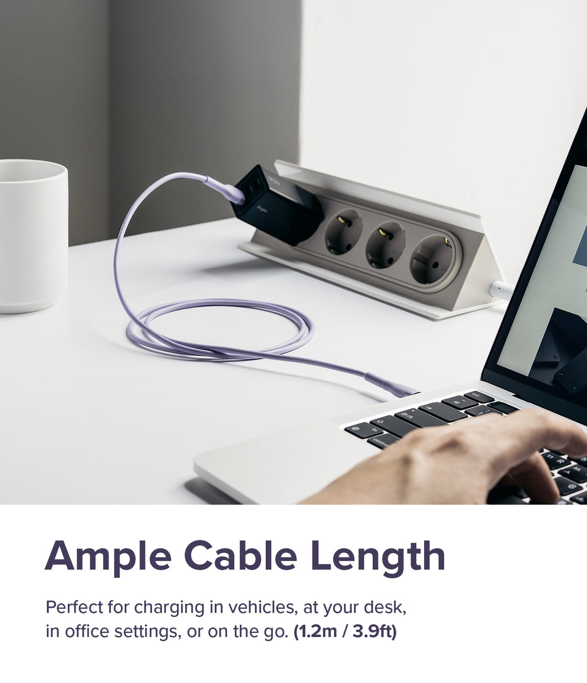 Ringke Fast Charging Pastel Cable - C Type-Lightning - Ringke Fast Charging Pastel Cable - A pastel purple charging cable connects a laptop to a wall outlet on a white desk.