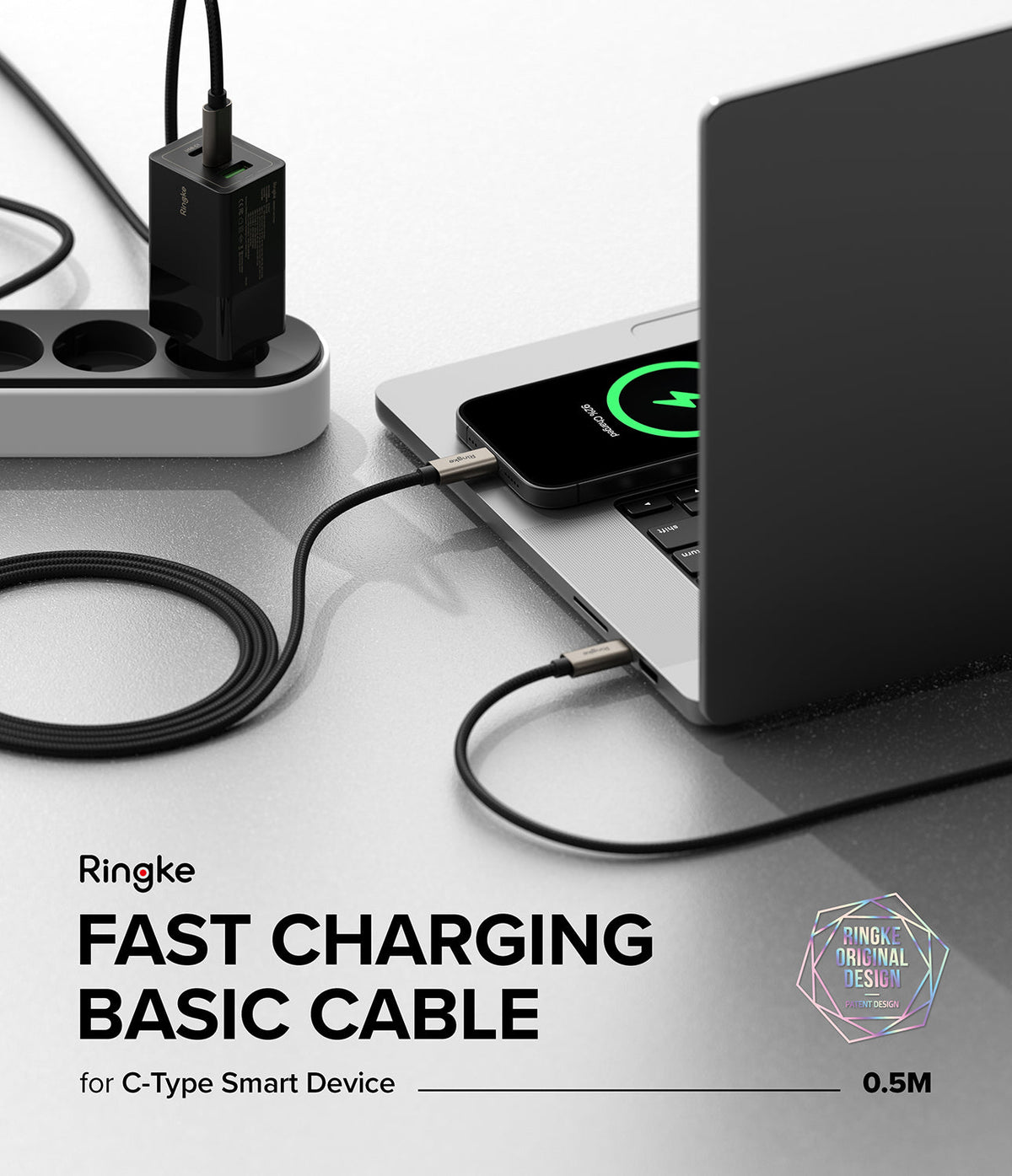Ringke Fast Charging Basic Cable USB-C to USB-C - Black braided cable connecting a wall charger to a smartphone.