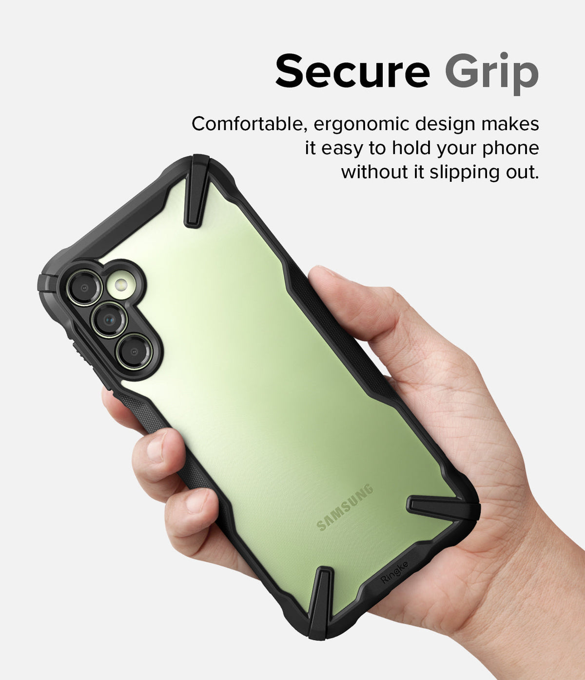 Galaxy A14 Case | Fusion-X - Hand holding a light green Samsung phone in a rugged black protective case with text Secure Grip.