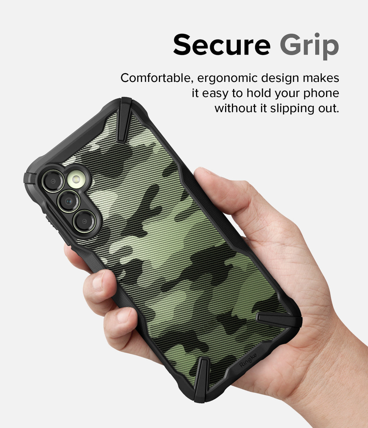 Galaxy A14 Case | Fusion-X - Hand holding a Galaxy A14 with a black and green camouflage Fusion-X case for a secure grip.