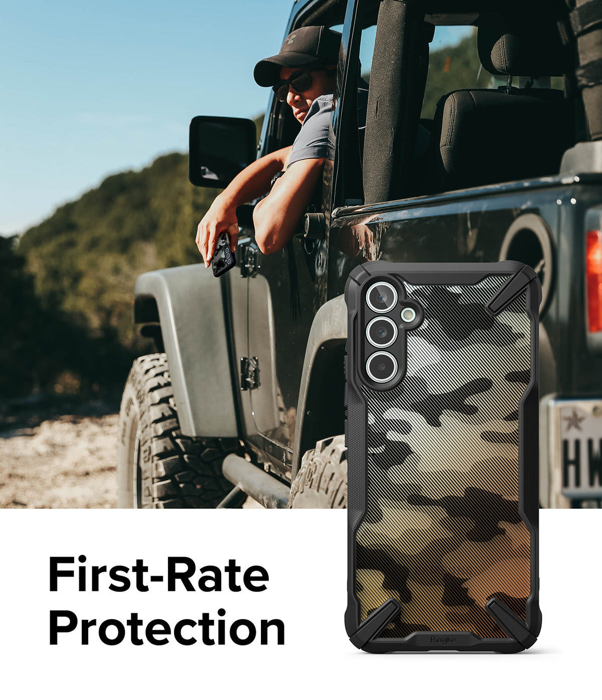Galaxy A34 Case | Fusion-X - Camouflage phone case with black bumpers held by a driver in a rugged off-road vehicle.