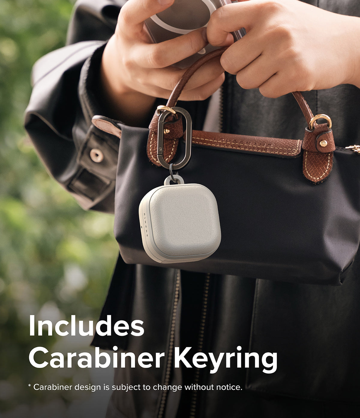 Galaxy Buds 4 Pro / 4 Case | Onyx Magnetic - Light gray earbud case hanging from a black handbag via a metal carabiner.