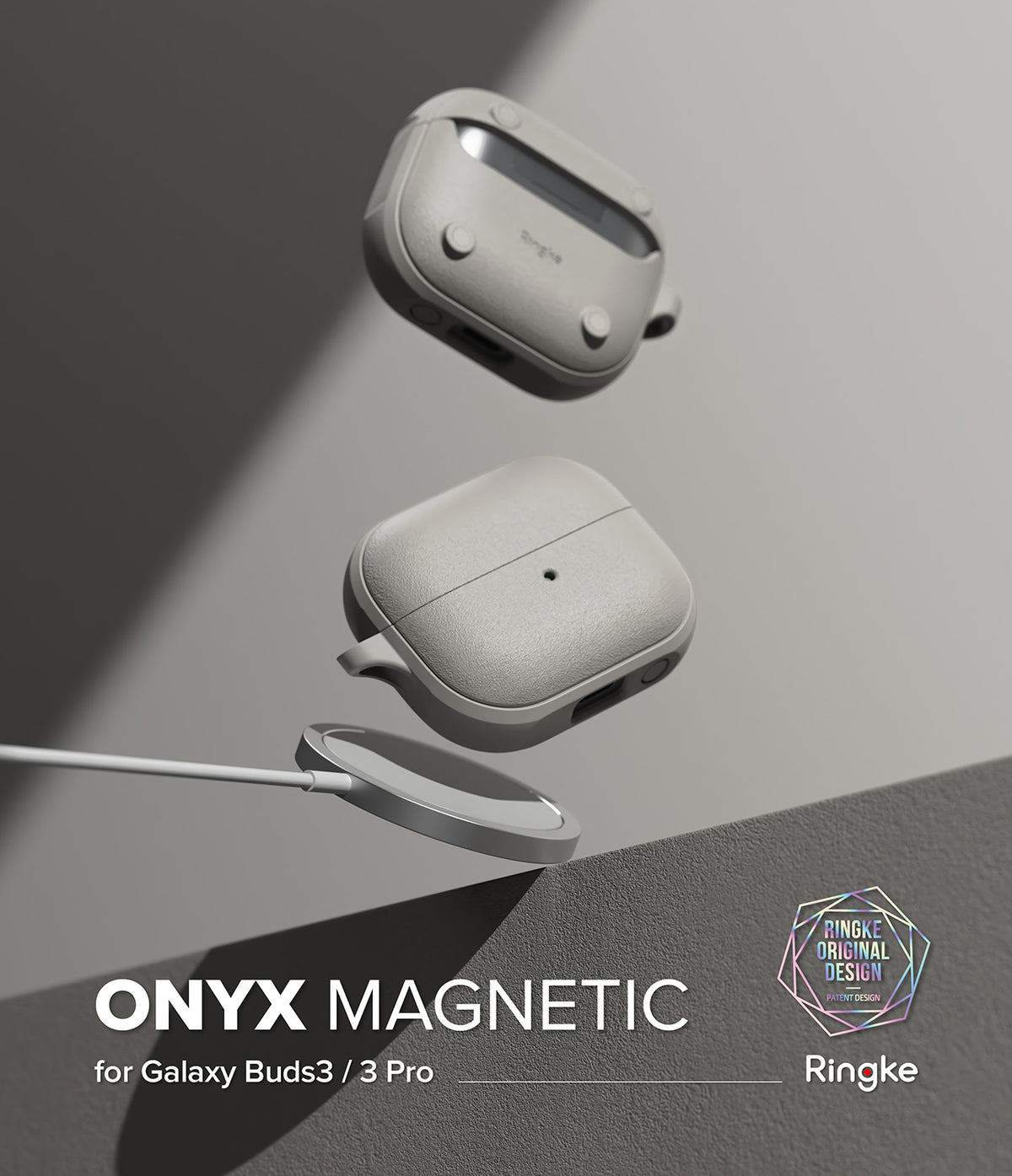 Galaxy Buds 3 Pro / 3 / 3 FE | Onyx Magnetic - Two gray textured earbud cases floating above a magnetic wireless charger.