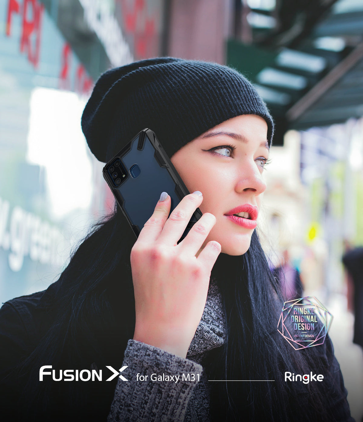 Galaxy M31 Case | Fusion-X - Woman in a beanie holding a black Galaxy M31 phone with a Fusion-X protective case to her ear.