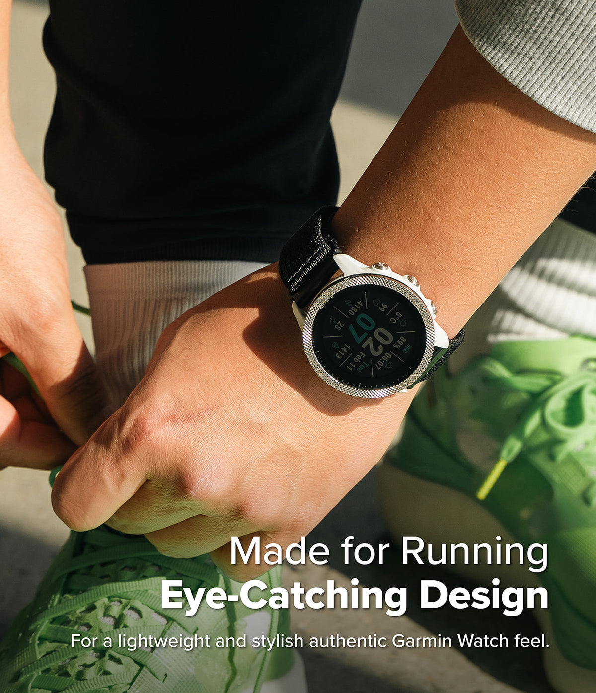 Forerunner 955 | Bezel Styling - A person tying green running shoes while wearing a white Garmin watch with a textured silver bezel.