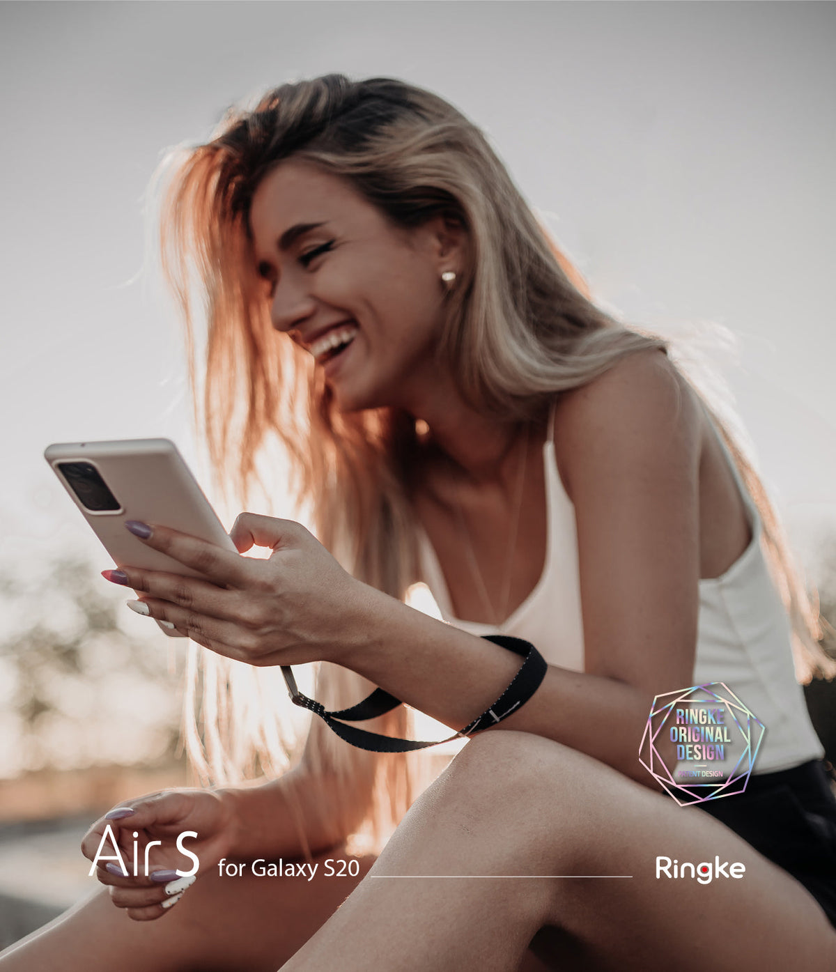 Galaxy Note 20 Case | Air-S - Smiling blonde woman outdoors holding a white phone with a black wrist strap in a protective case.