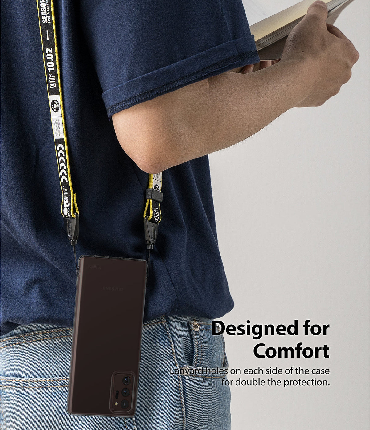 Galaxy Note 20 Case | Air - A person wearing a phone case with a yellow and black branded lanyard attached to both sides.