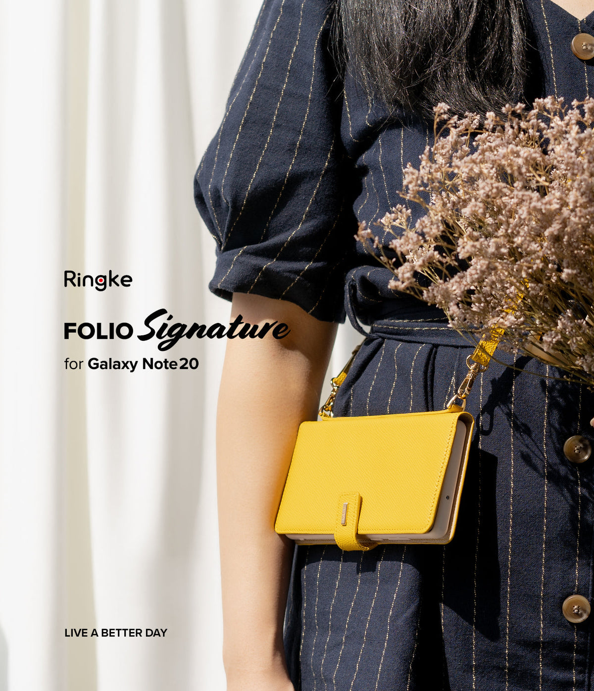 Galaxy Note 20 Case | Folio Signature Yellow - A person wearing a navy striped dress holds a bright yellow folio phone case.