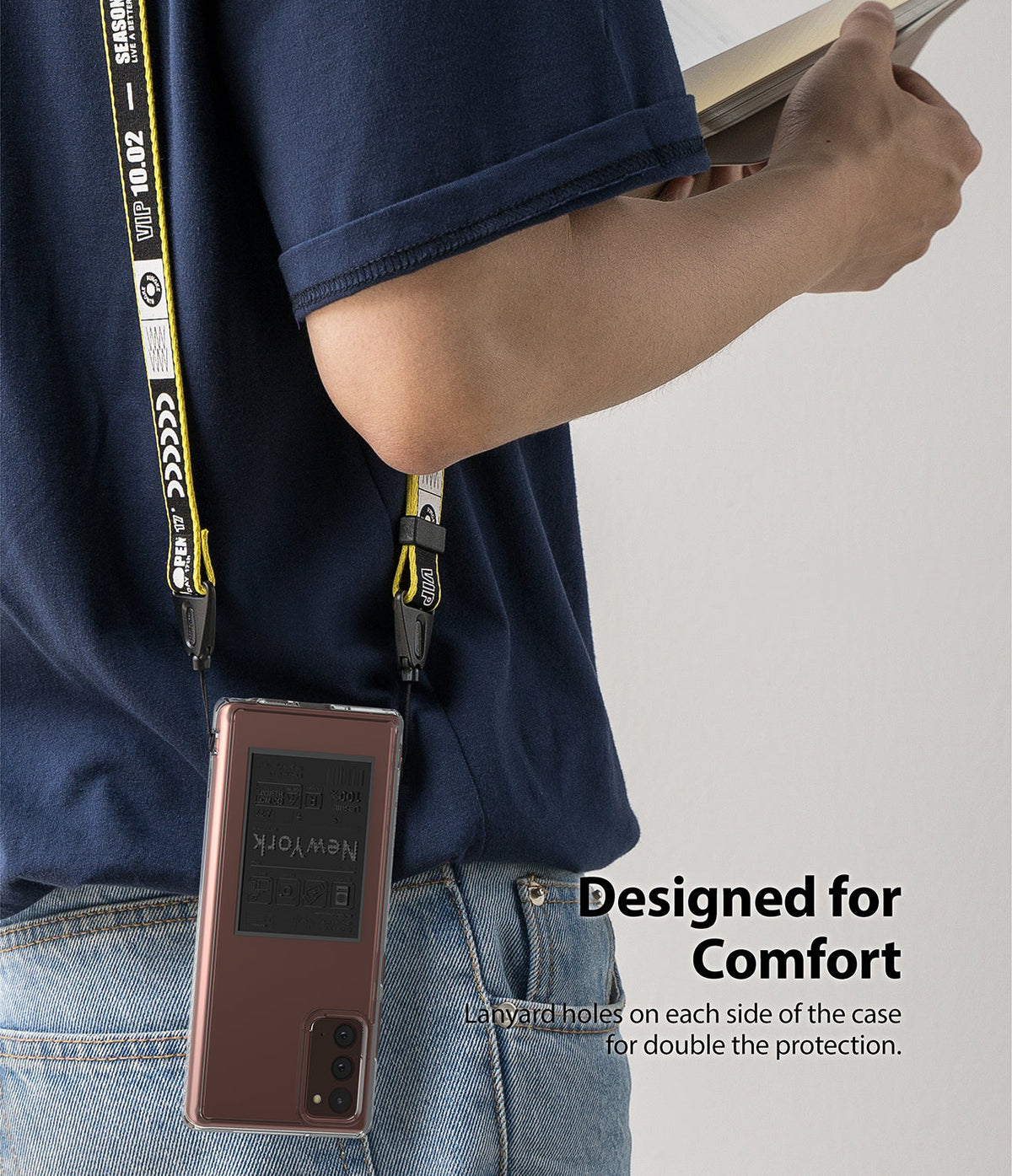 Galaxy Note 20 Case | Fusion Design - A phone in a protective case hanging from a yellow and black branded lanyard.
