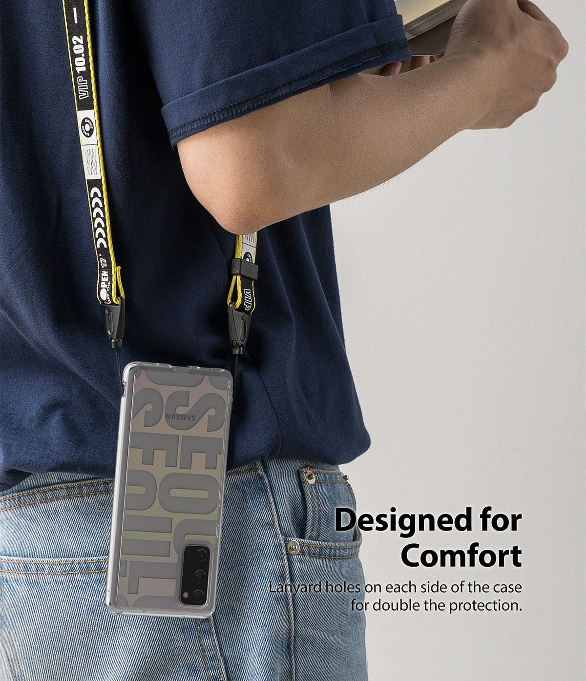 Galaxy S20 FE Case | Fusion Design - Person wearing a phone case with a yellow lanyard attached to dual side holes.