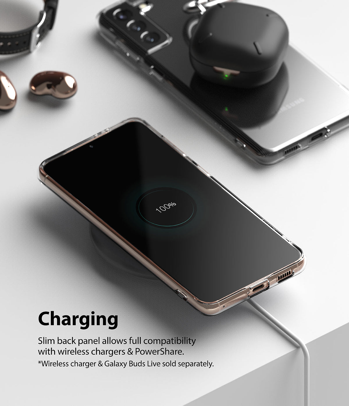 Galaxy S21 Plus Case | Air - A clear phone case on a wireless charger showing 100% battery, with earbuds on a second phone.