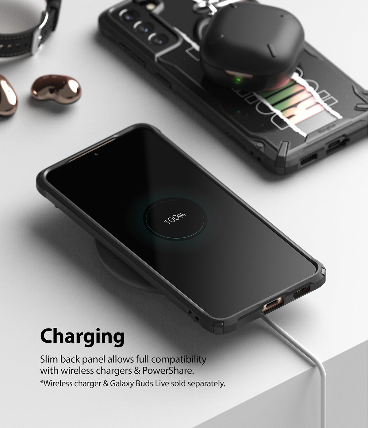 Galaxy S21 Plus Case | Fusion-X Design - Phone in rugged case wirelessly charging on a pad with earbuds nearby.