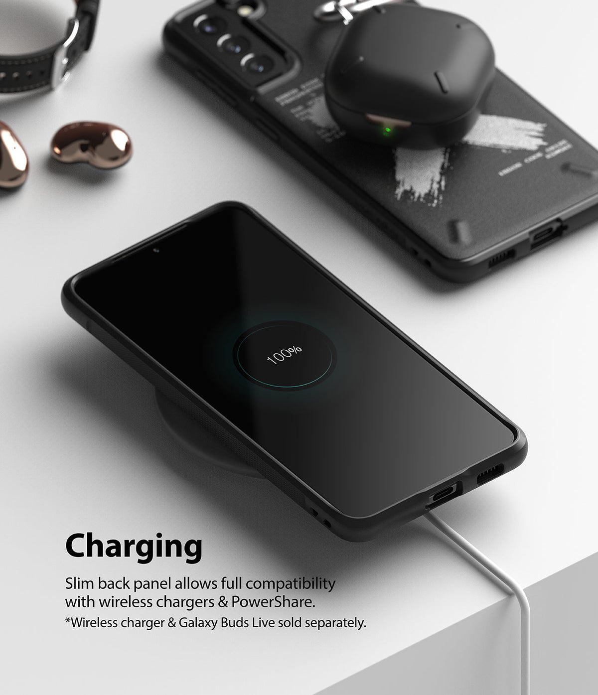 Galaxy S21 Case | Onyx Design - Black smartphone in Onyx case wirelessly charging on a white surface with earbuds nearby.