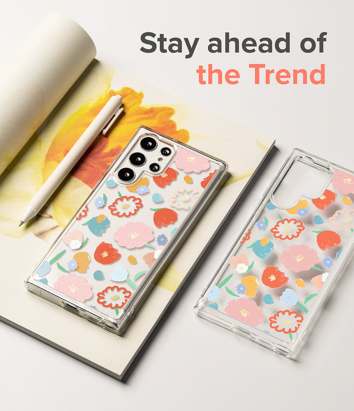 Galaxy S22 Ultra Case | Fusion Design - Clear phone cases with colorful floral patterns on a notebook with a pen.