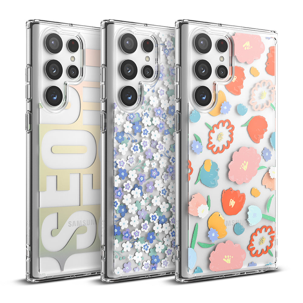 Galaxy S22 Ultra Case | Fusion Design - Three clear phone cases featuring Seoul text, small blue flowers, and colorful floral patterns.