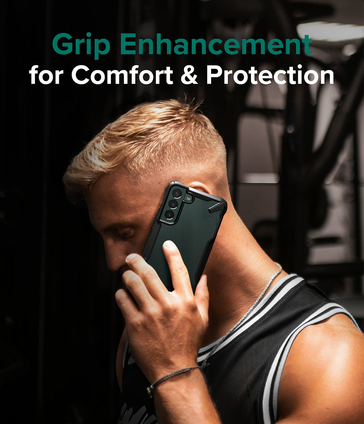 Galaxy S22 Plus Case Combo | Fusion-X Case + Screen Protector + Camera Protector - Galaxy S22 Plus Case Combo - Man talking on a phone with a black Fusion-X protective case in a gym setting.