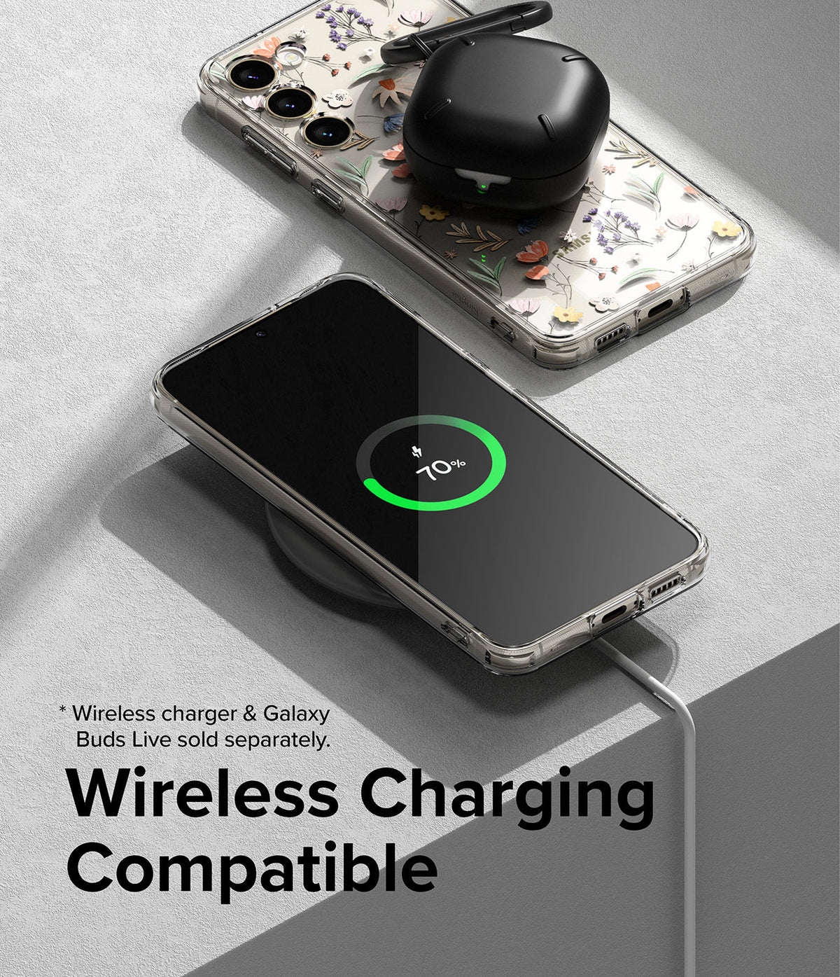 Galaxy S23 Plus Case | Fusion Design - Floral phone case on a wireless charger with a charging phone and earbuds.