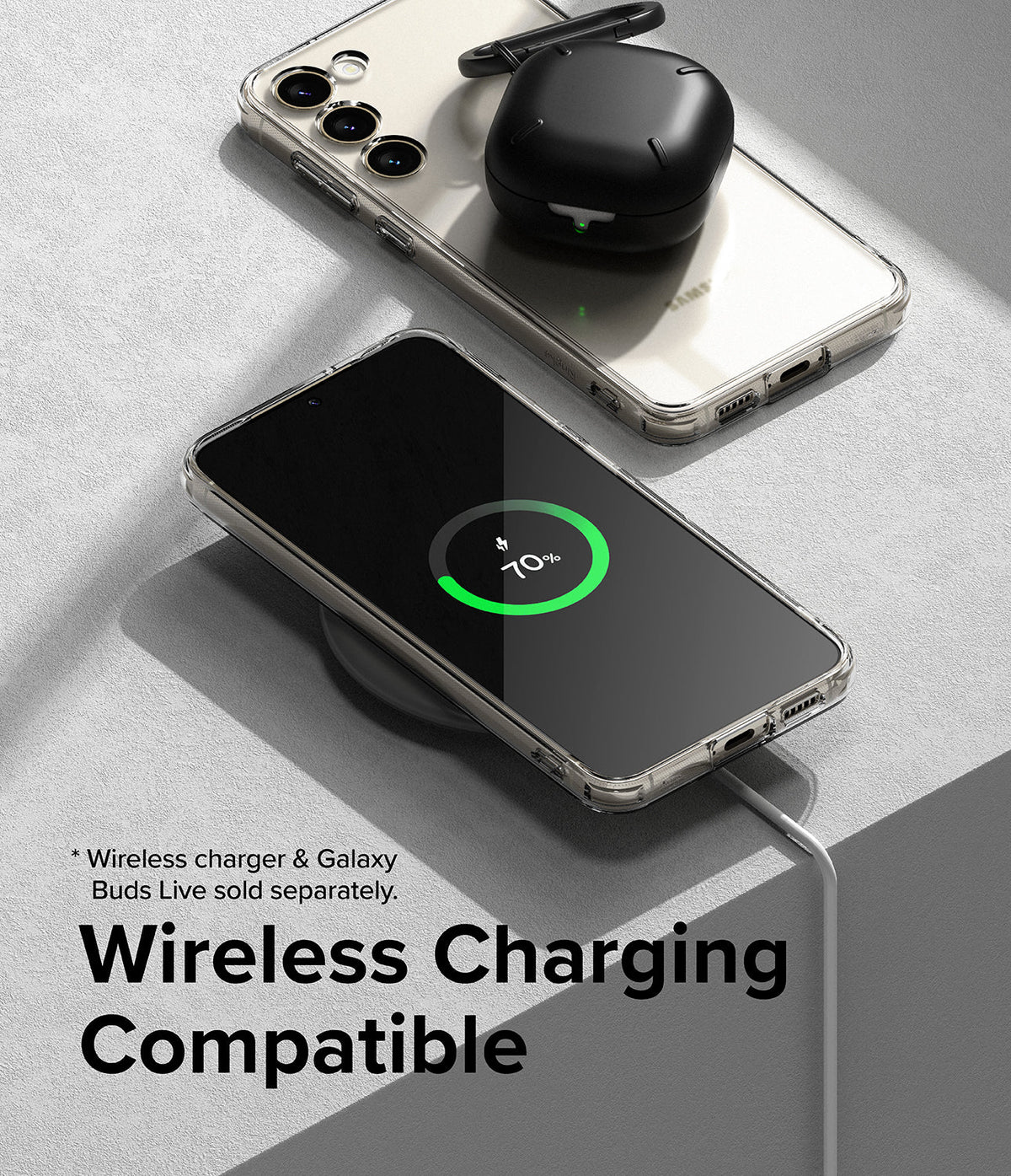 Galaxy S23 Plus Case | Fusion - Clear phone case on a wireless charger showing 70% battery with earbuds on top.