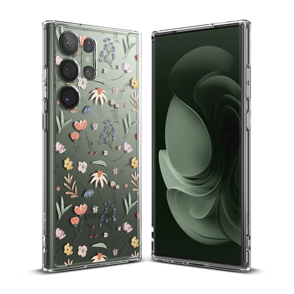 Galaxy S23 Ultra Case | Fusion Design - Clear phone case with colorful floral pattern on a green Galaxy S23 Ultra.