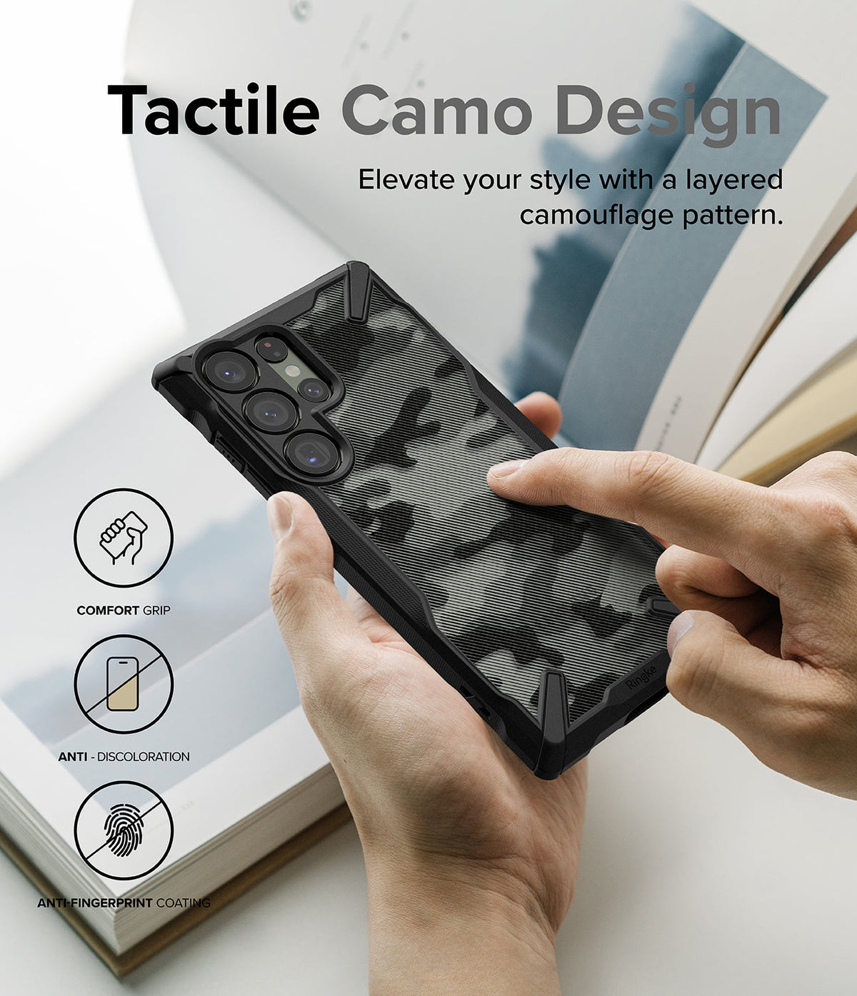 Galaxy S23 Ultra Case | Fusion-X - Hands holding a black phone case with a tactile, layered camouflage pattern.