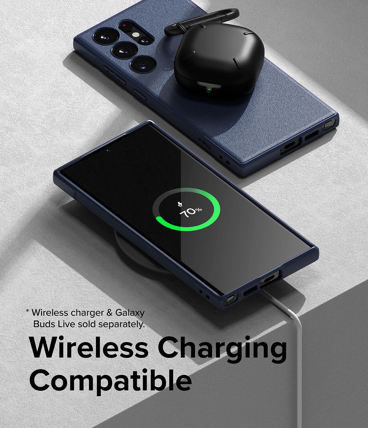 Galaxy S23 Ultra Case | Onyx - Navy blue phone case on a Galaxy S23 Ultra charging wirelessly with black earbuds on top.