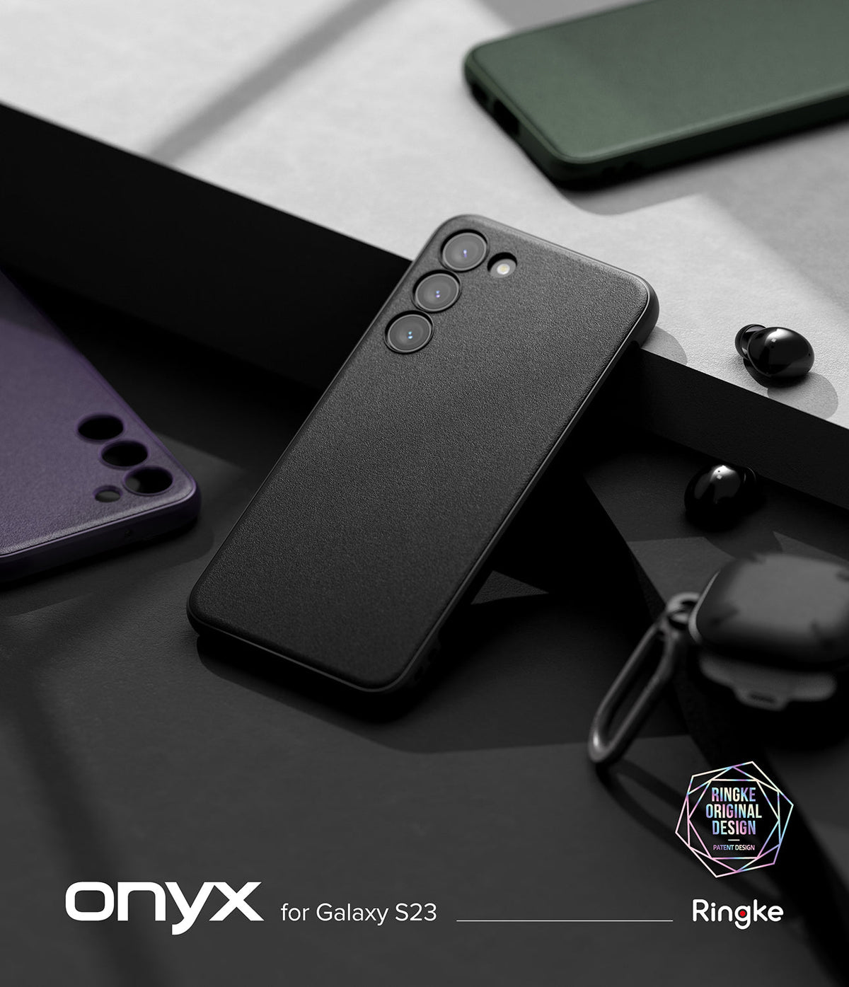 Galaxy S23 Case | Onyx - Black textured Galaxy S23 case resting on a geometric surface with other phone cases and earbuds.