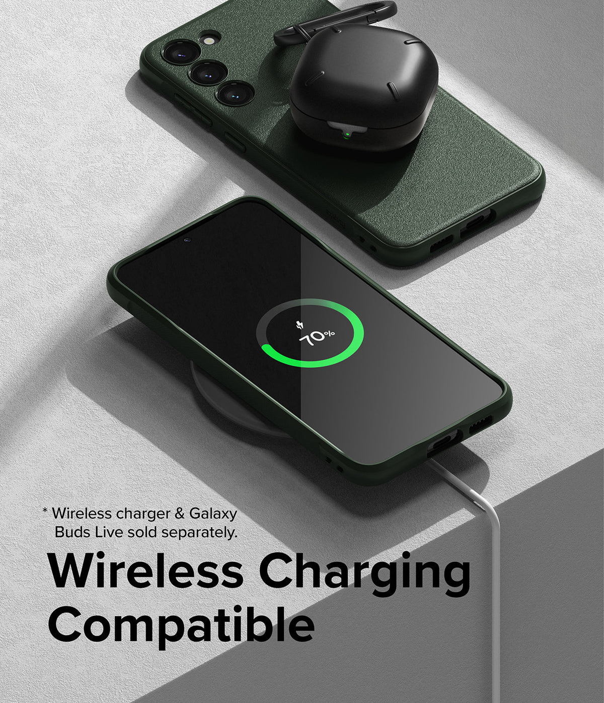 Galaxy S23 Case | Onyx - Dark green Galaxy S23 case on a wireless charger showing 70% battery with black earbuds nearby.