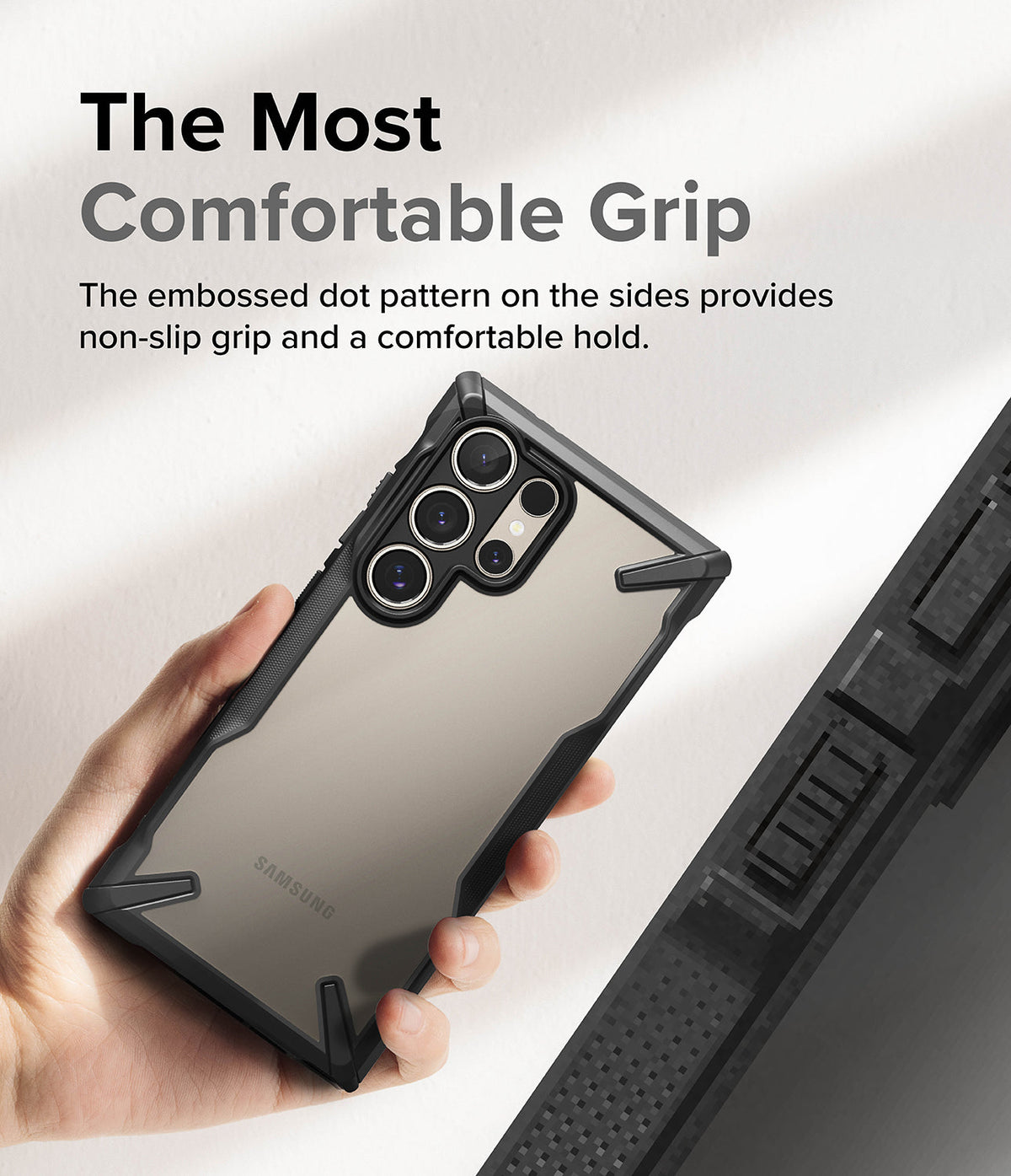 Galaxy S24 Ultra Case | Fusion-X - Hand holding a phone in a black protective case with a textured, dotted side grip.