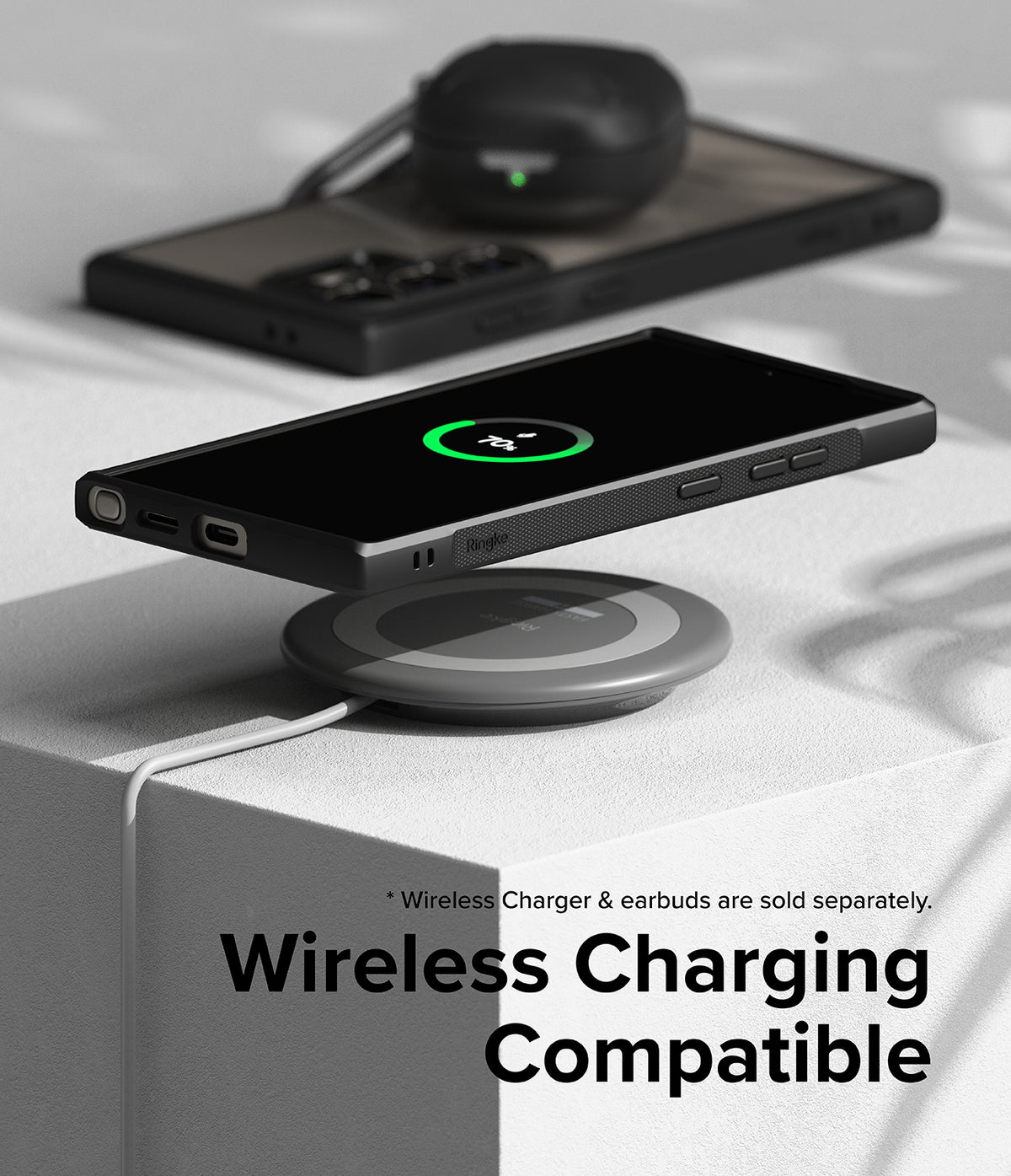 Galaxy S24 Ultra Case | Fusion Bold - Smartphone in a black case wirelessly charging on a circular pad.